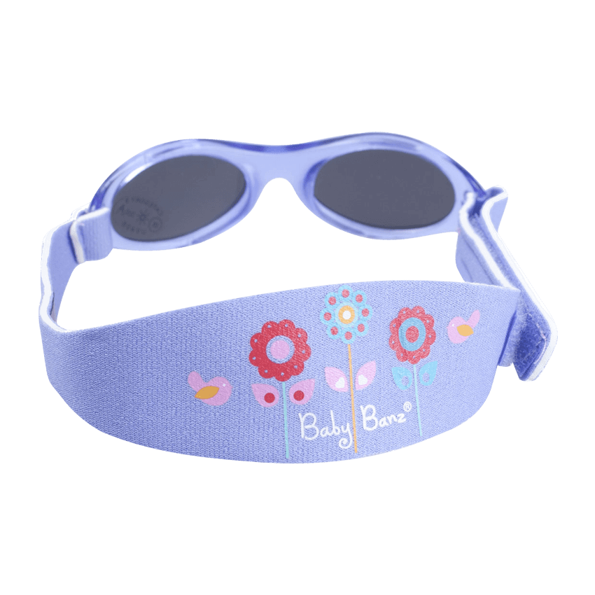 Solbriller for barn og baby i klassisk stil. Herlig lilla farge med små blomster på båndet.